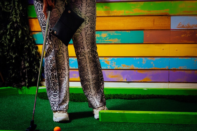 Lady playing crazy golf