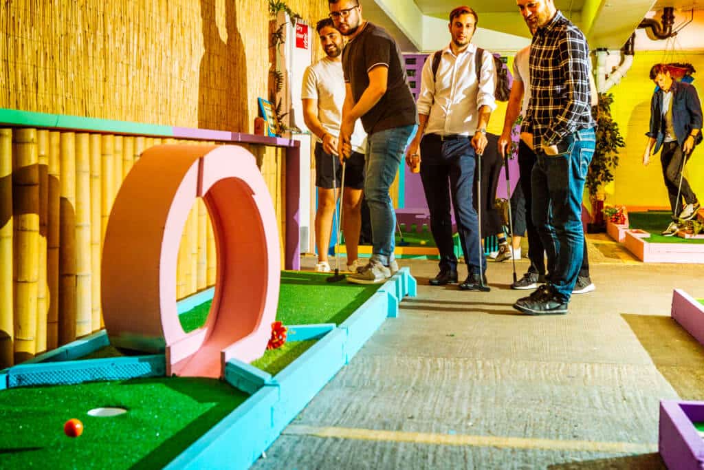 young men playing crazy golf