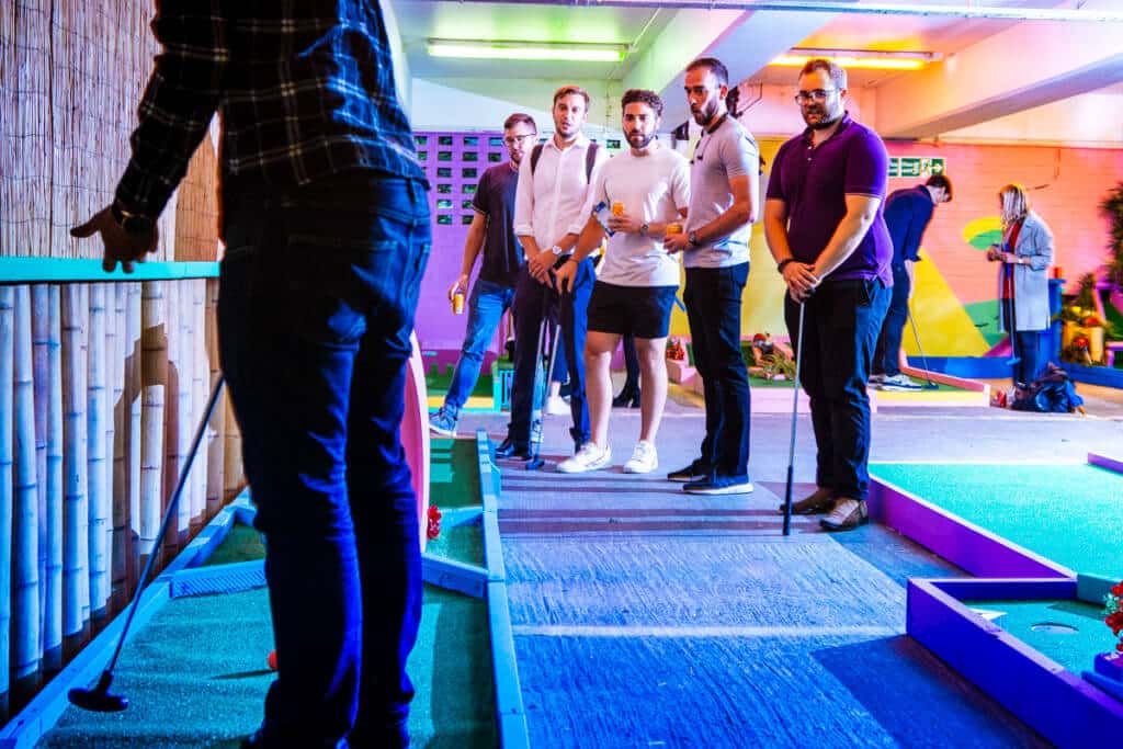 young men playing crazy golf